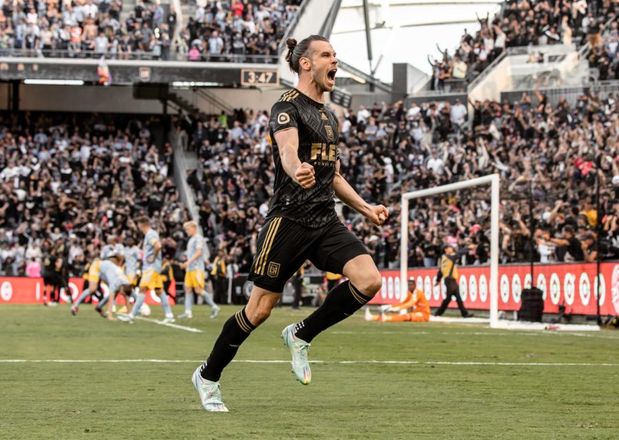 (FWD) Gareth Bale rushing toward the fans as he scored the equalizer in the final minutes of the match