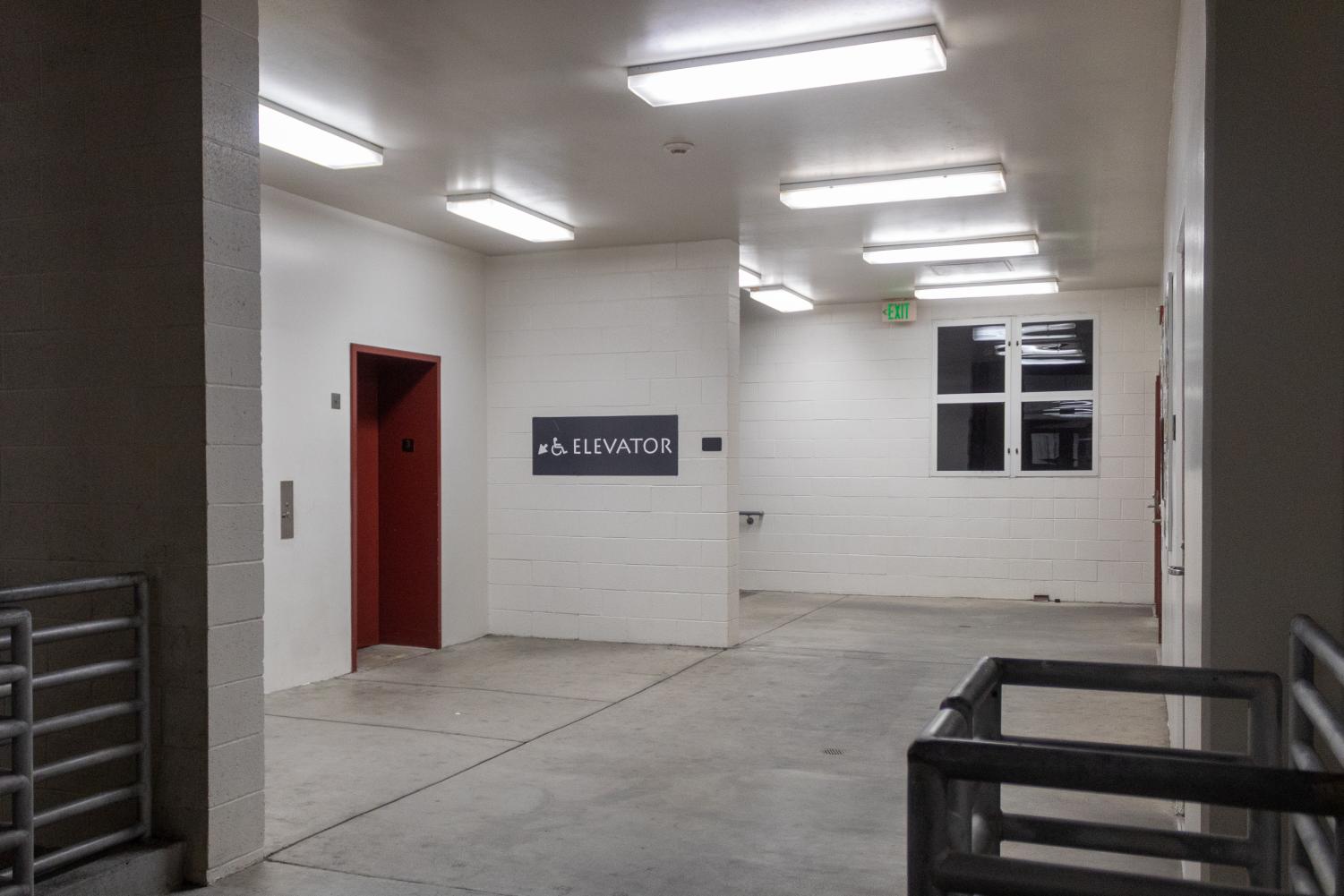 Two elevators and a flight of stairs are in front of the student restrooms in the Rio Hondo College Science Building.