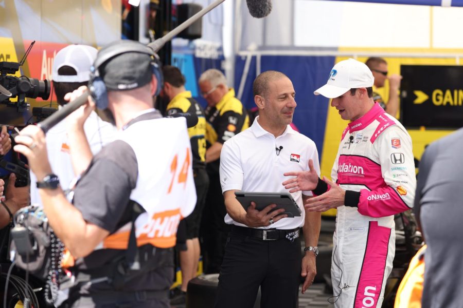 Kyle Kirkwood watched a replay of his flying lap during the Firestone Fast Six that gave him pole position while being interviewed inside the Andretti team paddock after the conclusion of qualifying at Long Beach, Calif..