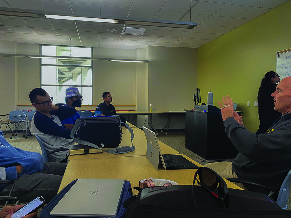 Glenn Haeyo (right) lectures on the importance of motivation even when stressed.