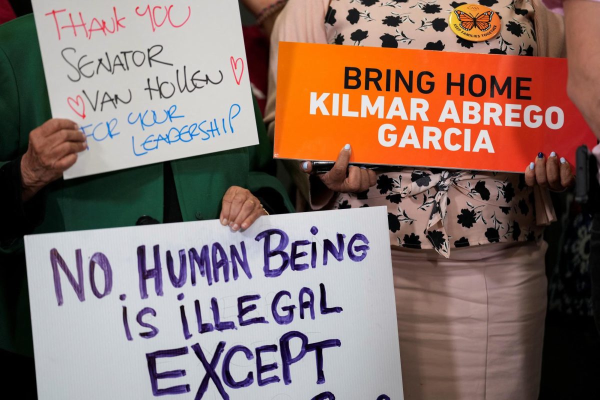 FILE PHOTO:Signs in support of Kilmar Abrego Garcia, a Salvadoran man deported from the U.S. without due process by the Trump administration, as an alleged MS-13 gang member and sent to the Terrorism Confinement Center (CECOT), a maximum security prison in El Salvador, are displayed during a press conference held by U.S. Senator Chris Van Hollen (D-MD) after returning from a visit to El Salvador, where he advocated for the release of Abrego Garcia, at Dulles International Airport in Sterling, Virginia, U.S., April 18, 2025. REUTERS/Kent Nishimura