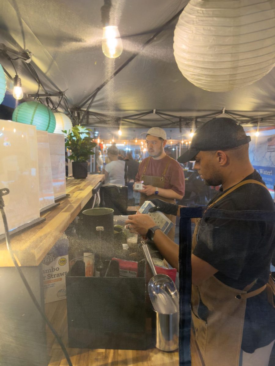 Jimmy and Blair at their vendor station completing their customers orders during the night market.