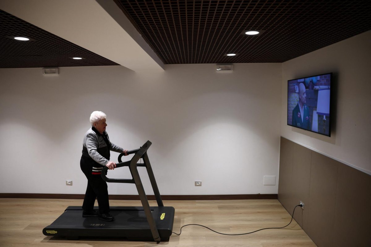 Resident at "Aris Senior Living" Maria Boniti, 86, exercises on a treadmill in the facility's gym in Rome, Italy, March 19, 2026. REUTERS/Guglielmo Mangiapane