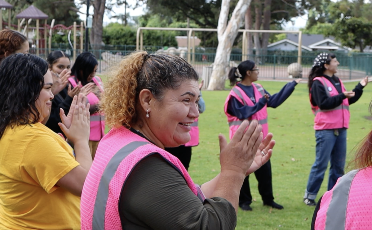 At Michigan Park in Whittier, Somos El Voto canvassers celebrate their impact 
on the number of mail-in ballots received prior to the April 14th cutoff.