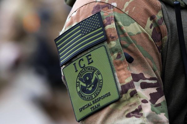 A member of the U.S. Department of Homeland Security ICE Special Response Team (SRT) displays a unit patch on their uniform during a protest at U.S. Immigration and Customs Enforcement (ICE) headquarters in Portland, Oregon, U.S., October 4, 2025.  REUTERS/Carlos Barria